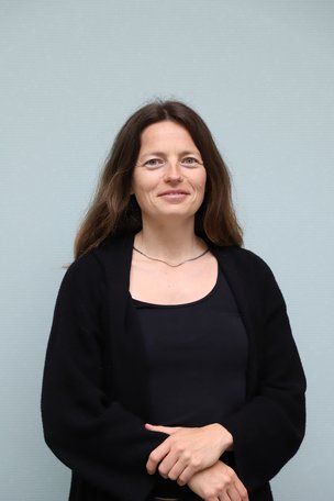 Angelika Merkel, PhD.